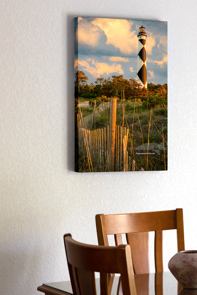 20"x30" x1.5" stretched canvas print hanging in the dining room of Sand fence and clouds at Cape Lookout Lighthouse on the Outer Banks of NC.