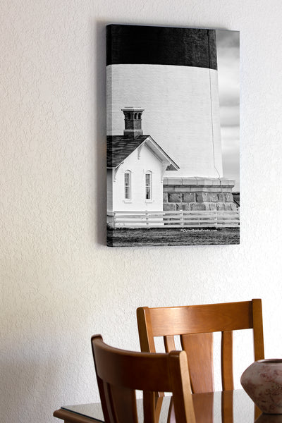 20"x30" x1.5" stretched canvas print hanging in the dining room of Bodie Island Lighthouse and small light keepers cottage in black and white on the Outer Banks of NC.