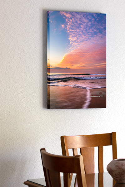 20"x30" x1.5" stretched canvas print hanging in the dining room of Sunrise clouds moving in to the beach at Corolla on the Outer Banks of North Carolina.