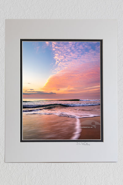 8 x 10 luster print in a 11 x 14 ivory and black double mat of Sunrise clouds moving in to the beach at Corolla on the Outer Banks of North Carolina.