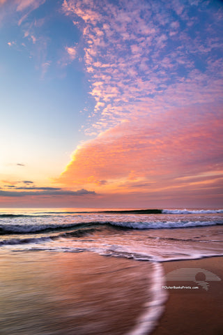 Sunrise clouds moving in to the beach at Corolla on the Outer Banks of North Carolina.