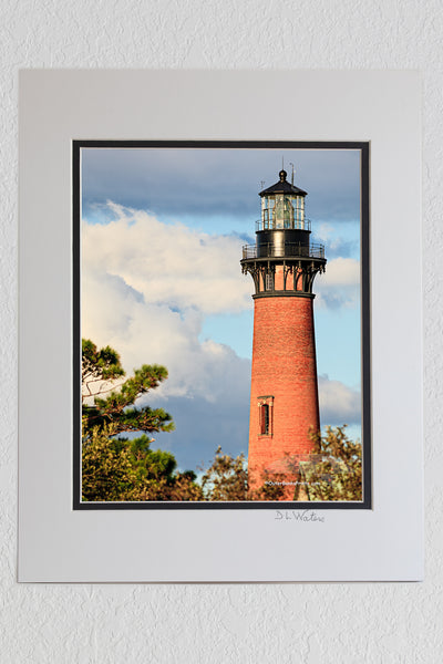 8 x 10 luster print in a 11 x 14 ivory and black double mat of A beautiful afternoon that the Corolla NC lighthouse on the Outer Banks.