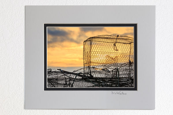 5 x 7 luster prints in a 8 x 10 ivory and black double mat of  Crab traps piled on the dock at sunrise waiting to be set.
