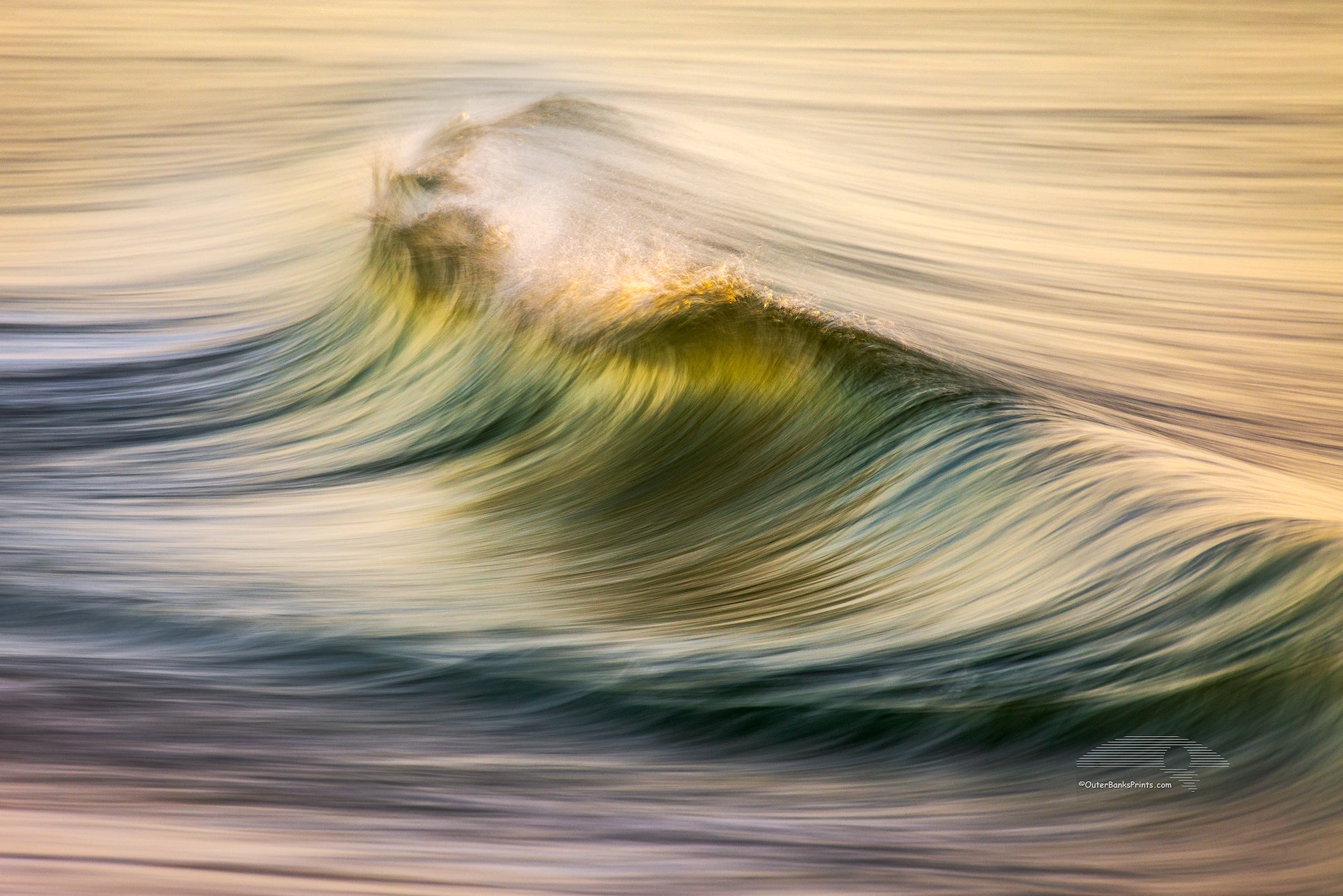 Motion of the early morning surf on the beach at Kitty Hawk on the Outer Banks of NC.