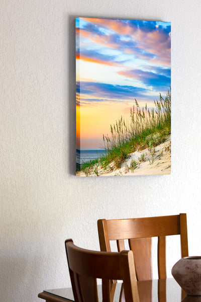 20"x30" x1.5" stretched canvas print hanging in the dining room of A pastel sand dune, sea oats, and sunrise at the beach in Corolla on the Outer Banks of NC.