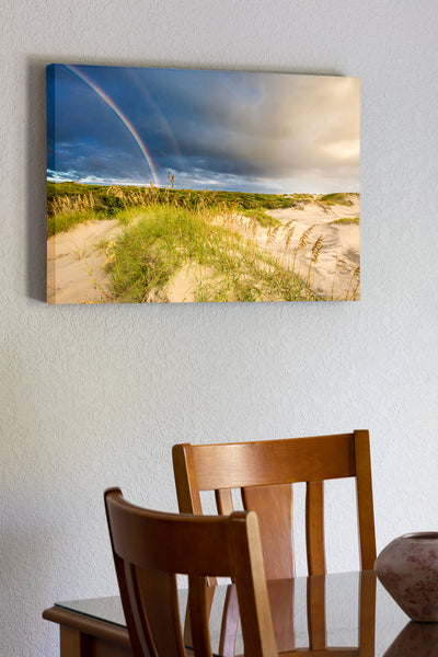 20"x30" x1.5" stretched canvas print hanging in the dining room of Outer Bank sand dunes and double rainbow in Corolla North Carolina.