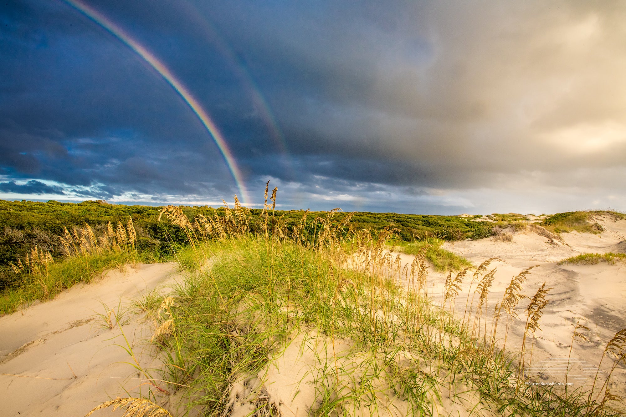 Outer Bank sand dunes and double rainbow in Corolla North Carolina.
