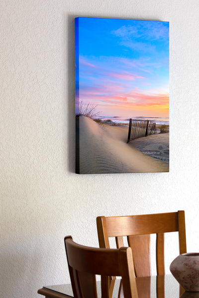 20"x30" x1.5" stretched canvas print hanging in the dining room of Sand dune and sand fence at sunrise on a Nags Head beach, Outer Banks NC.
