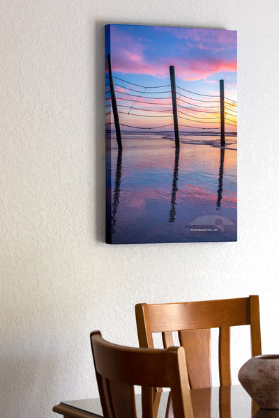 20"x30" x1.5" stretched canvas print hanging in the dining room of Fence reflection at sunrise that keeps the wild horses north of Corolla on the Outer Banks of North Carolina.