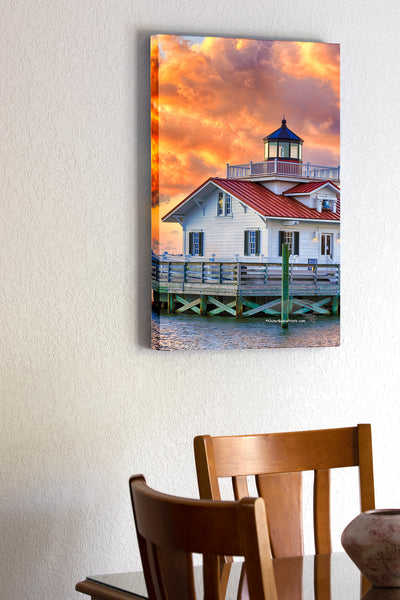  20"x30" x1.5" stretched canvas print hanging in the dining room of Sunrise and clouds at Roanoke Marshes Lighthouse on Shallow Bag Bay in Manteo North Carolina.