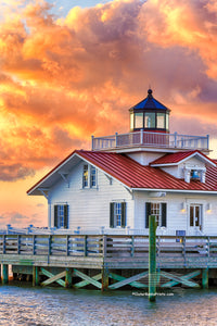 Sunrise and clouds at Roanoke Marshes Lighthouse on Shallow Bag Bay in Manteo North Carolina.