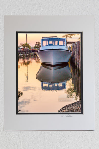 8 x 10 luster print in a 11 x 14 ivory and black double mat of Fishing boat tied up next to the dock at sunrise on the Outer Banks of NC.