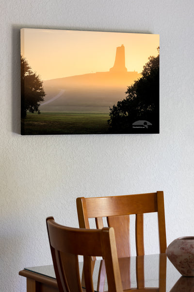 20"x30" x1.5" stretched canvas print hanging in the dining room of Silhouette on a foggy morning of the Wright Brothers National Monument on the Outer Banks, NC.