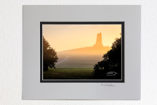 8 x 10 luster print in a 11 x 14 ivory and black double mat of Silhouette on a foggy morning of the Wright Brothers National Monument on the Outer Banks, NC.