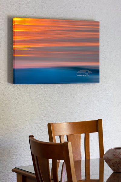 20"x30" x1.5" stretched canvas print hanging in the dining room of Sunrise on surf with camera movement on the Outer Banks of North Carolina.