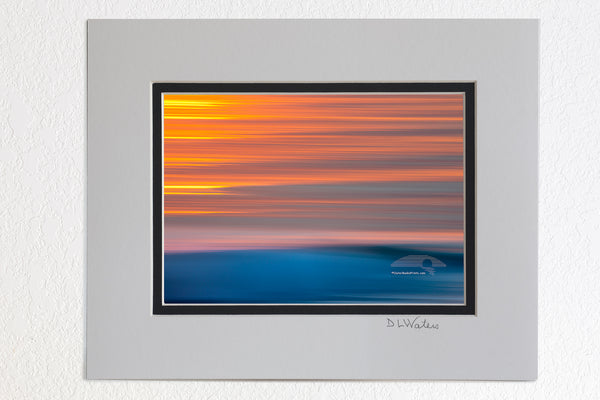 5 x 7 luster prints in a 8 x 10 ivory and black double mat of Sunrise on surf with camera movement on the Outer Banks of North Carolina.