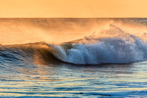 Golden wave at Kitty Hawk Beach Outer Banks North Carolina.