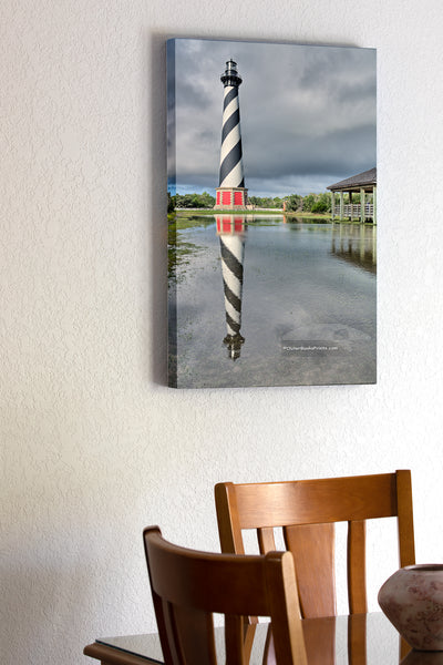 20"x30" x1.5" stretched canvas print hanging in the dining room of Cape Hatteras Lighthouse and reflection on Hatteras Island. This iconic spiral lighthouse is still in use today.  Edit alt text