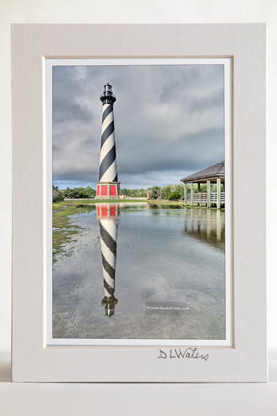 4 x 6 luster print in a 5 x 7 ivory mat of  Cape Hatteras Lighthouse and reflection on Hatteras Island. This iconic spiral lighthouse is still in use today.  Edit alt text