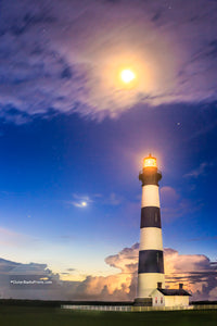 Bodie Island Lighthouse  in a summer heat lightning storm under a full moon.