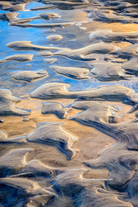 A close-up of sand and water pattern at Oregon Inlet North Carolina.