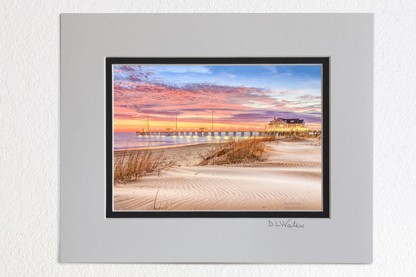 5 x 7 luster prints in a 8 x 10 ivory and black double mat of Early morning sunrise at Jenette's fishing pier in Nags Head North Carolina.