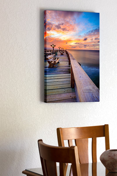 20"x30" x1.5" stretched canvas print hanging in the dining room of Peaceful sunrise at Kitty Hawk Fishing Pier on the Outer Banks of NC.