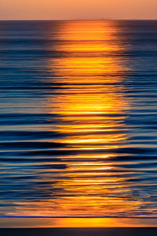 Moving the camera back-and-forth while the shutter was open created these lines of light in the ocean surf on the Outer Banks of North Carolina.