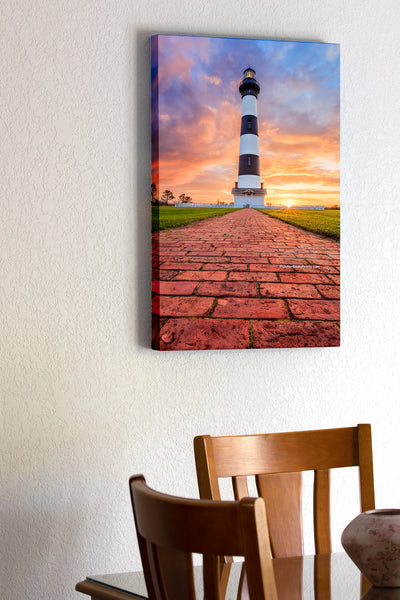20"x30" x1.5" stretched canvas print hanging in the dining room of A brick path leading to Bodie Island Lighthouse at sunrise on the Outer Banks of North Carolina.