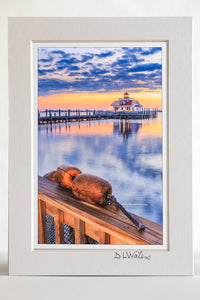 4 x 6 luster print in a 5 x 7 ivory mat of Roanoke Marshes Lighthouse and buoys at Christmas time in Manteo on the Outer Banks