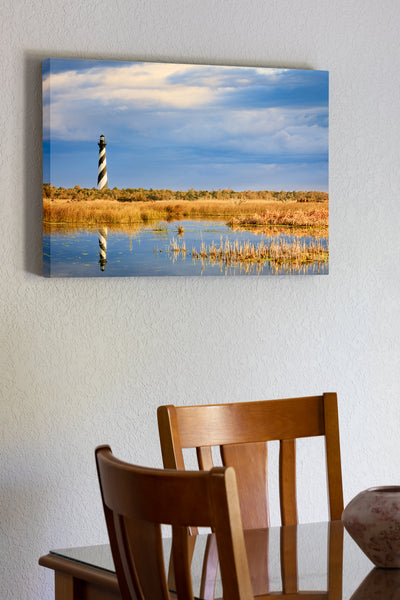 20"x30" x1.5" stretched canvas print hanging in the dining room of Cape Hatteras lighthouse reflected in the wild marshy landscape on the Outer Banks of NC.