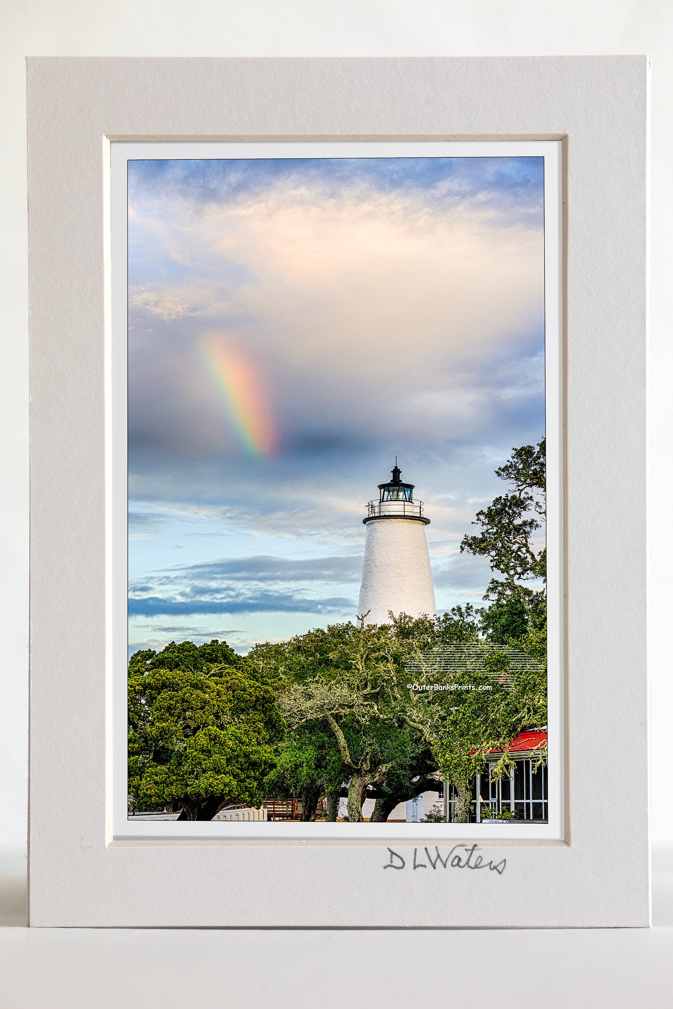 4 x 6 luster print in a 5 x 7 ivory mat of Ocracoke Lighthouse and a rainbow as the morning storm clears.