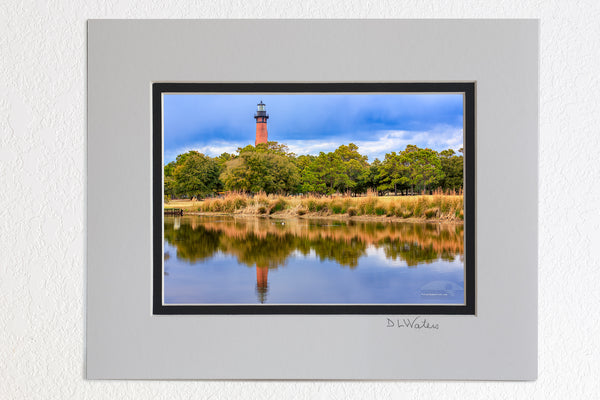  5 x 7 luster prints in a 8 x 10 ivory and black double mat of  Reflection of the Currituck Beach Lighthouse  in Corolla on a late afternoon.