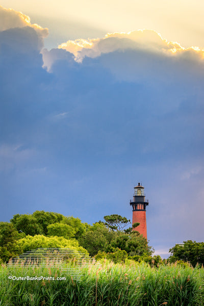 Currituck Beach Lighthouse and dramatic sky in Corolla on the Outer Banks of North Carolina.