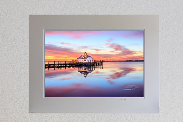 13 x 19 luster print in 18 x 24 ivory ￼￼mat of Manteno lighthouse and waterfron sunrise Roanoke Island on the Outer Banks of NC.