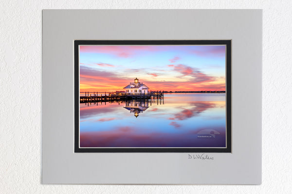 5 x 7 luster prints in a 8 x 10 ivory and black double mat of  Manteno lighthouse and waterfron sunrise Roanoke Island on the Outer Banks of NC.
