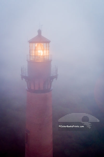 Aerial photograph of a foggy Currituck Beach Lighthouse in Corolla on the Outer Banks of NC.
