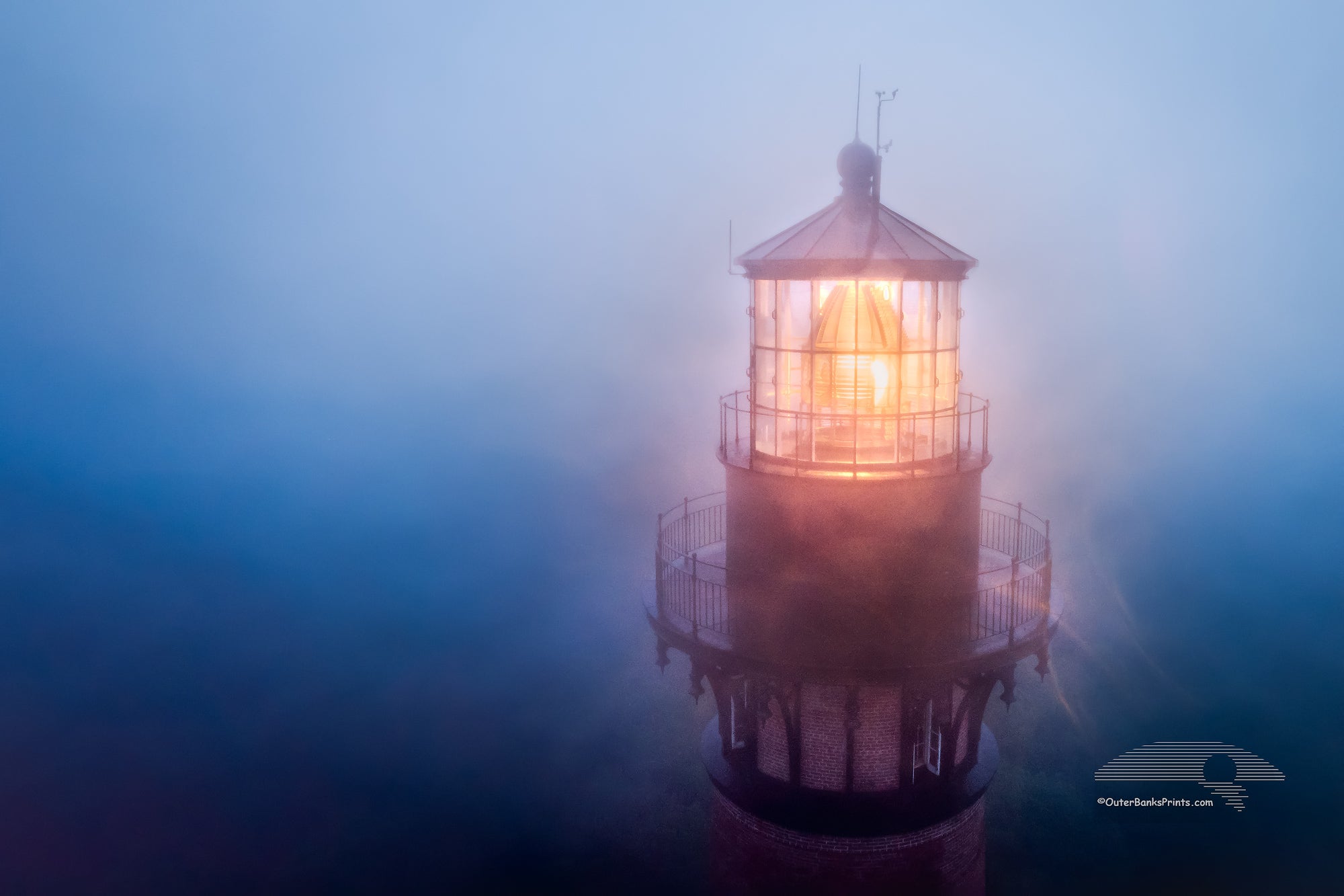 Aerial view of Currituck Beach Lighthouse in the fog at Corolla on the Outer Banks of NC.