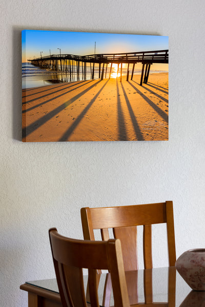 20"x30" x1.5" stretched canvas print hanging in the dining room of Morning shadows at Nags Head Pier.