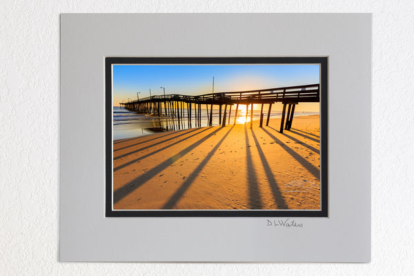 5 x 7 luster prints in a 8 x 10 ivory and black double mat of  Morning shadows at Nags Head Pier.