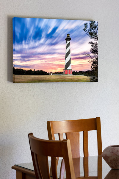 20"x30" x1.5" stretched canvas print hanging in the dining room of A long exposure of clouds and Cape Hatteras Lighthouse on the Outer Banks of NC.