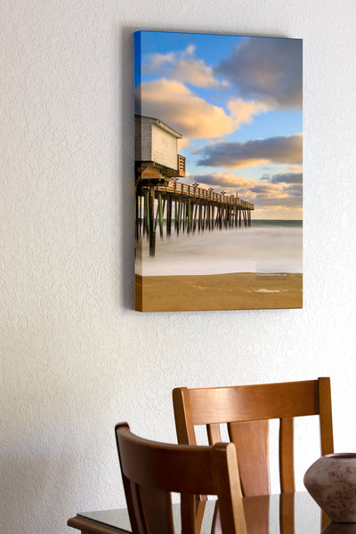 20"x30" x1.5" stretched canvas print hanging in the dining room of Long morning exposure of the beach and Kitty Hawk Fishing Pier, on the Outer Banks of NC.