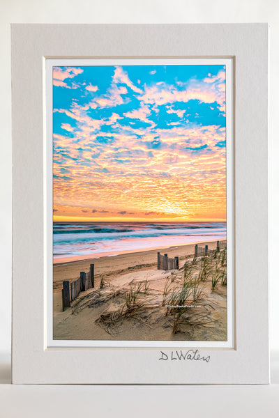 4 x 6 luster print in a 5 x 7 ivory mat of A beautiful sunrise over Kitty Hawk Beach on the Outer Banks of NC.