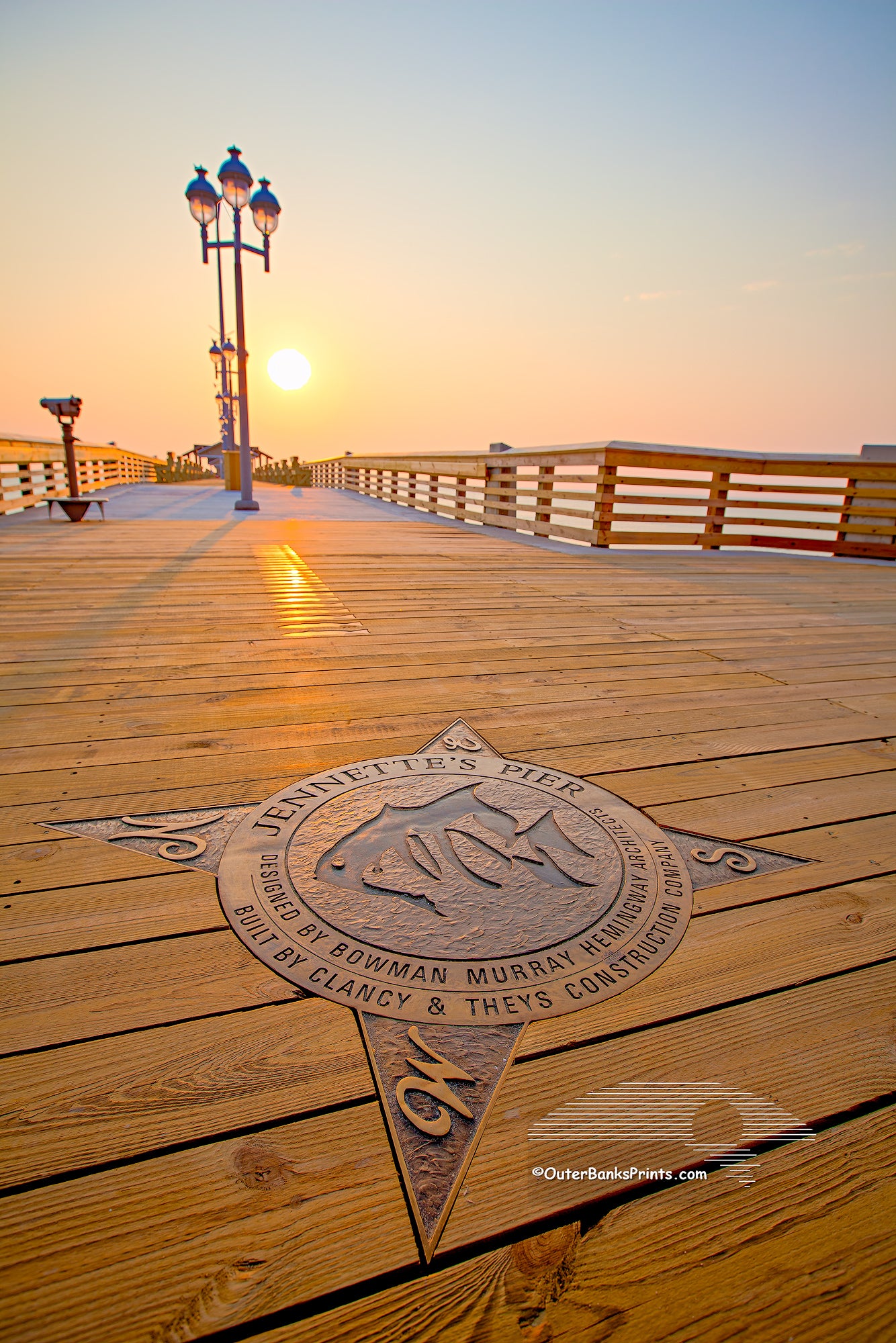 Close-up of a compass rose embedded in the deck of Jeanette's Pier in Nags Head on the Outer Banks of NC..