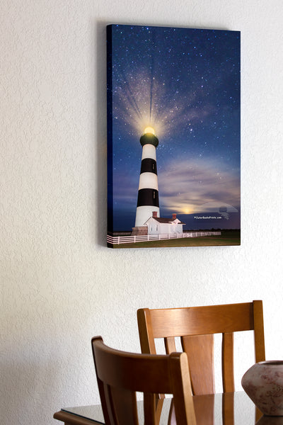 20"x30" x1.5" stretched canvas print hanging in the dining room of Bodie Island Lighthouse at night with stars and moon on the Outer Banks of NC