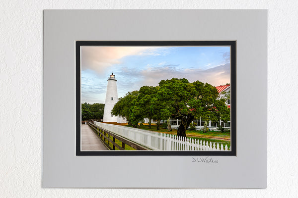 5 x 7 luster prints in a 8 x 10 ivory and black double mat of Sunrise on a stormy morning at Ocracoke Lighthouse.