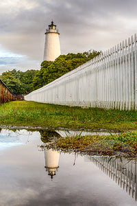 Ocracoke Lighthouse reflection after a rainstorm. Ocracoke Lighthouse is the oldest operating lighthouse in North Carolina.