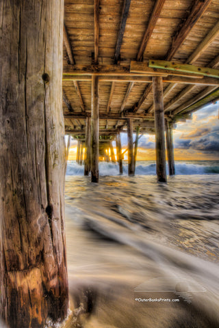 Moving waves at sunrise under Avalon Fishing Pier, Kill Devil Hills along the NC coast.