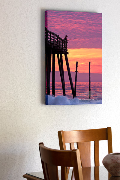 20"x30" x1.5" stretched canvas print hanging in the dining room of A silhouette of an incredible sunrise at Kitty Hawk pier.