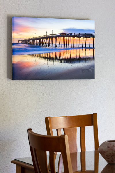 20"x30" x1.5" stretched canvas print hanging in the dining room of Nags Head Fishing Pier at sunrise reflected in the wet sand beach on the Outer Banks of NC.